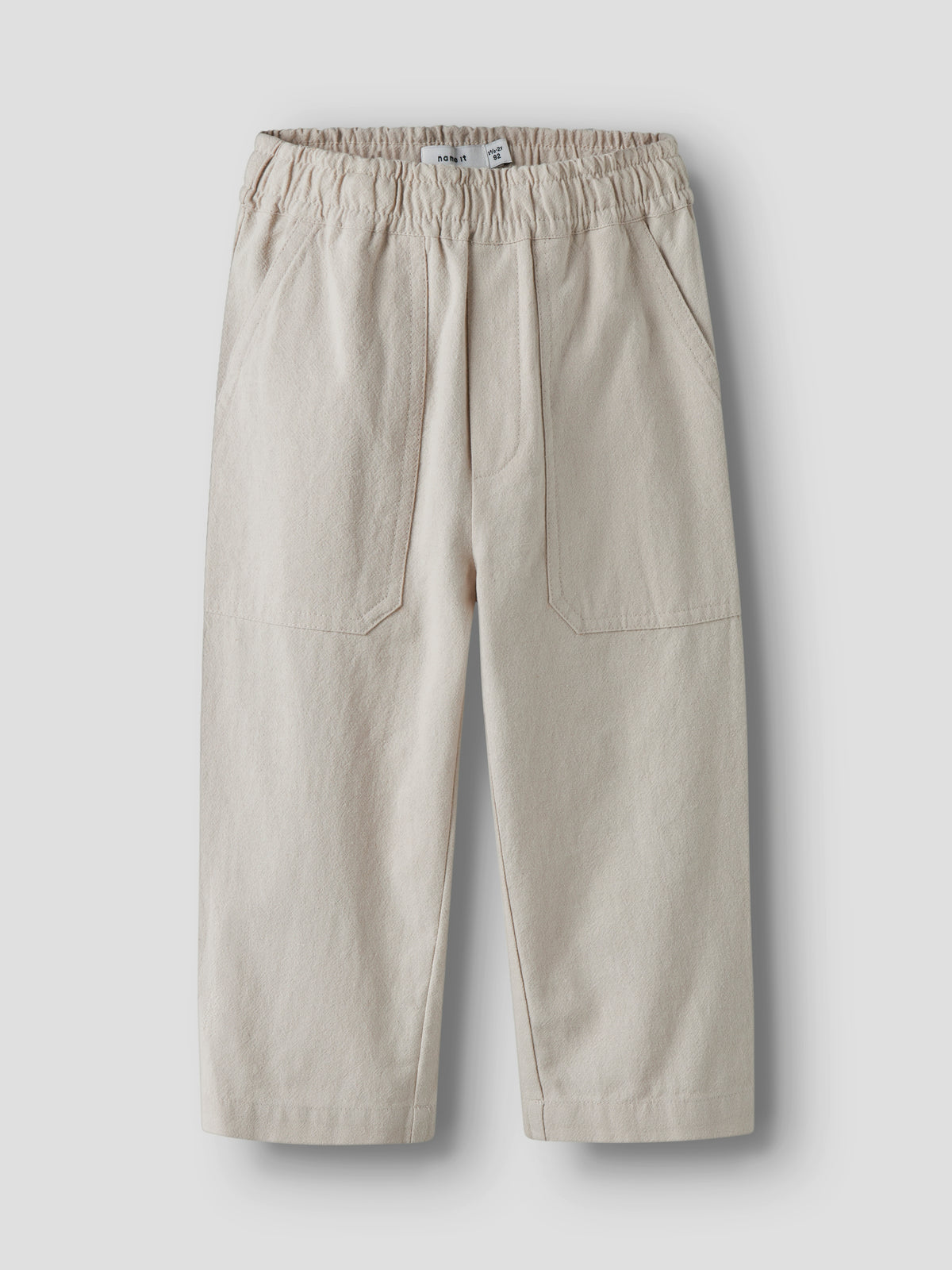 Leichte Baumwoll Kinderhose in Beige Vorderansicht von NAME IT im Bärechind Winterthur Zürich Schweiz kaufen.