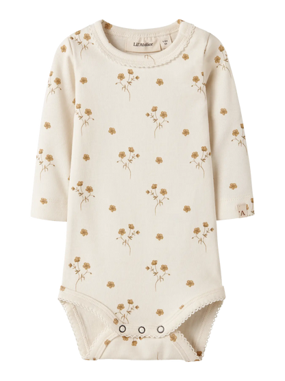 Langarm Baby Body aus Bio-Baumwolle mit Blumenprint von Lil’ Atelier, erhältlich bei Bärechind in Winterthur, Zürich, Schweiz.