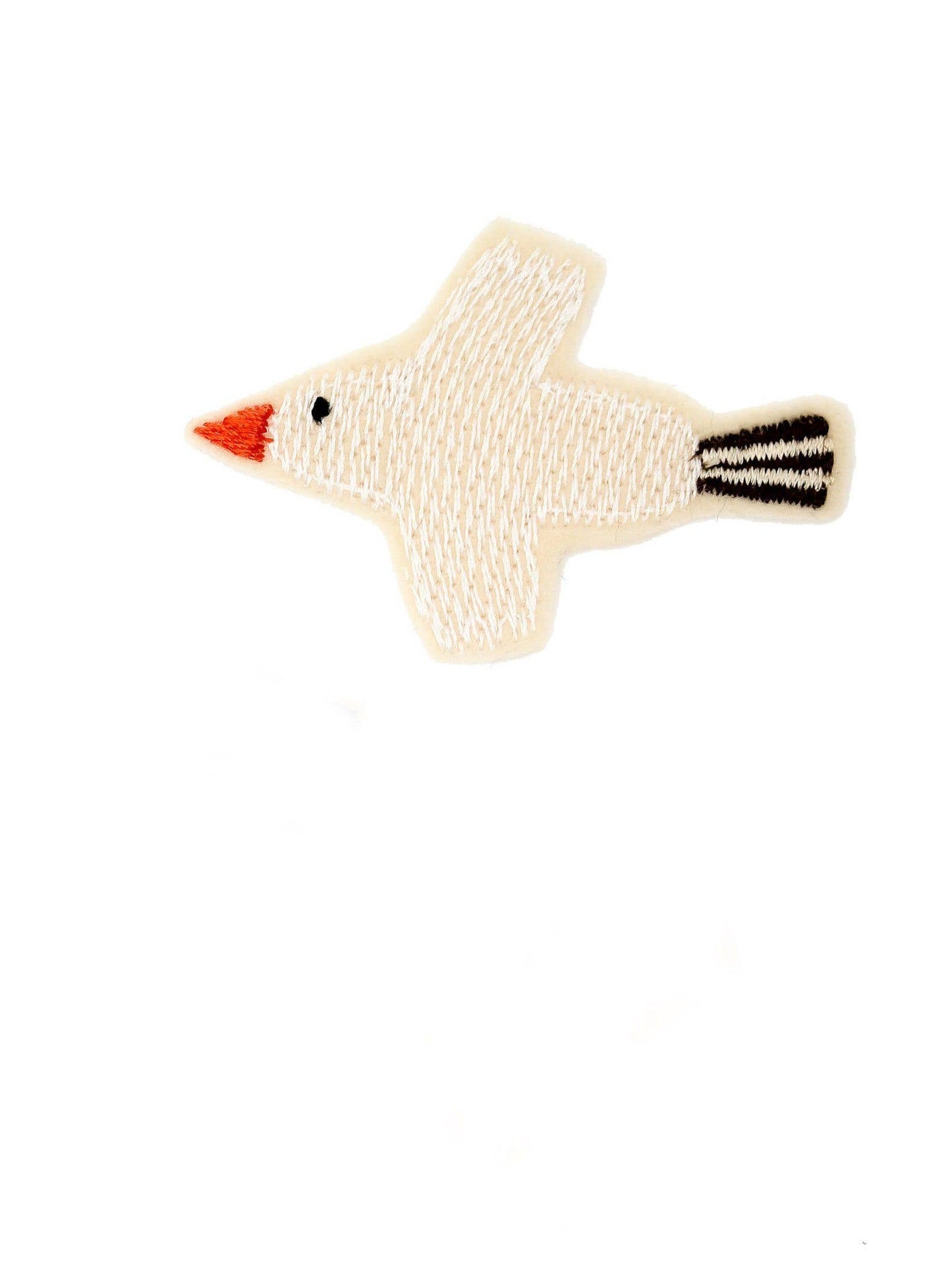 Das Bügelbild Vogel von Halfbird in Creme mit roten und schwarzen Details. Erhältlich im Bärechind Winterthur.