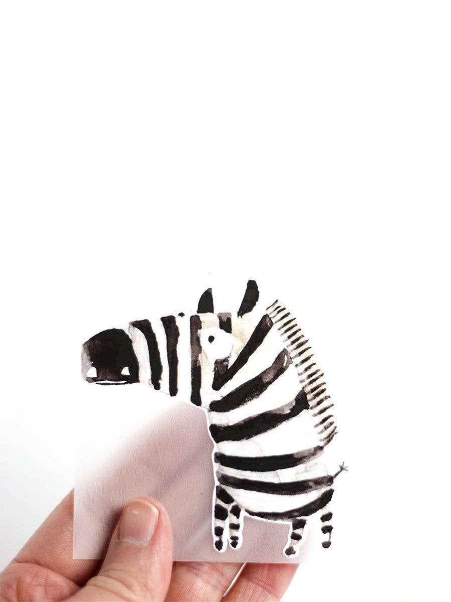 Das Bügelbild Zebra von Halfbird mit handgezeichneter Aquarellillustration eignet sich zum Verzieren und Reparieren von Kinderkleidung. Erhältlich im Bärechind Winterthur.