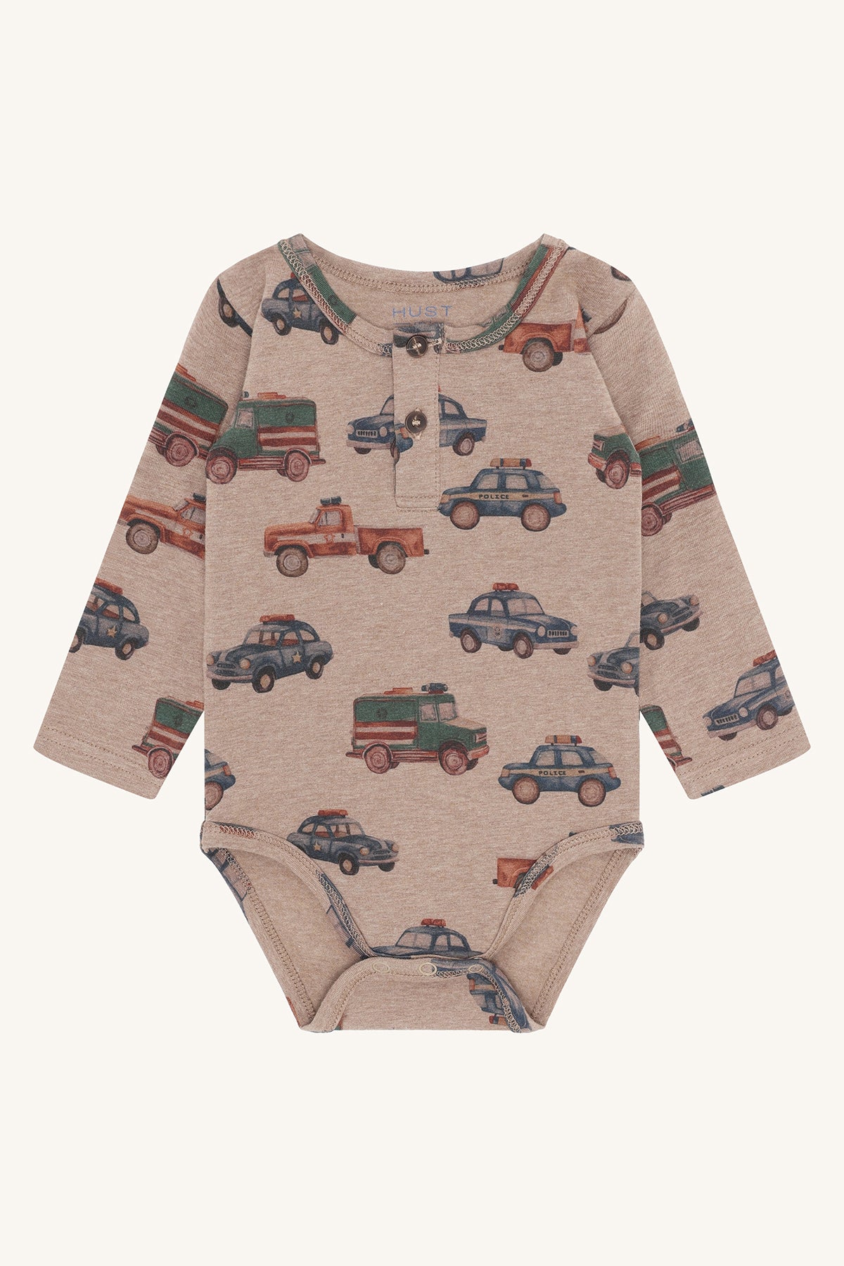 Babybody Billy von Hust&Claire in Biscuit mit Polizeiauto-Motiv aus Bio-Baumwolle, erhältlich im Bärechind Winterthur, Zürich Schweiz