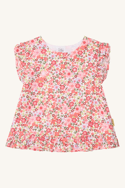 Hust & Claire Roselyn Kinderbluse mit buntem Blumenmuster in Rosa und Pink, V-Ausschnitt und Rüschen an den Schultern, Bärechind Winterthur.