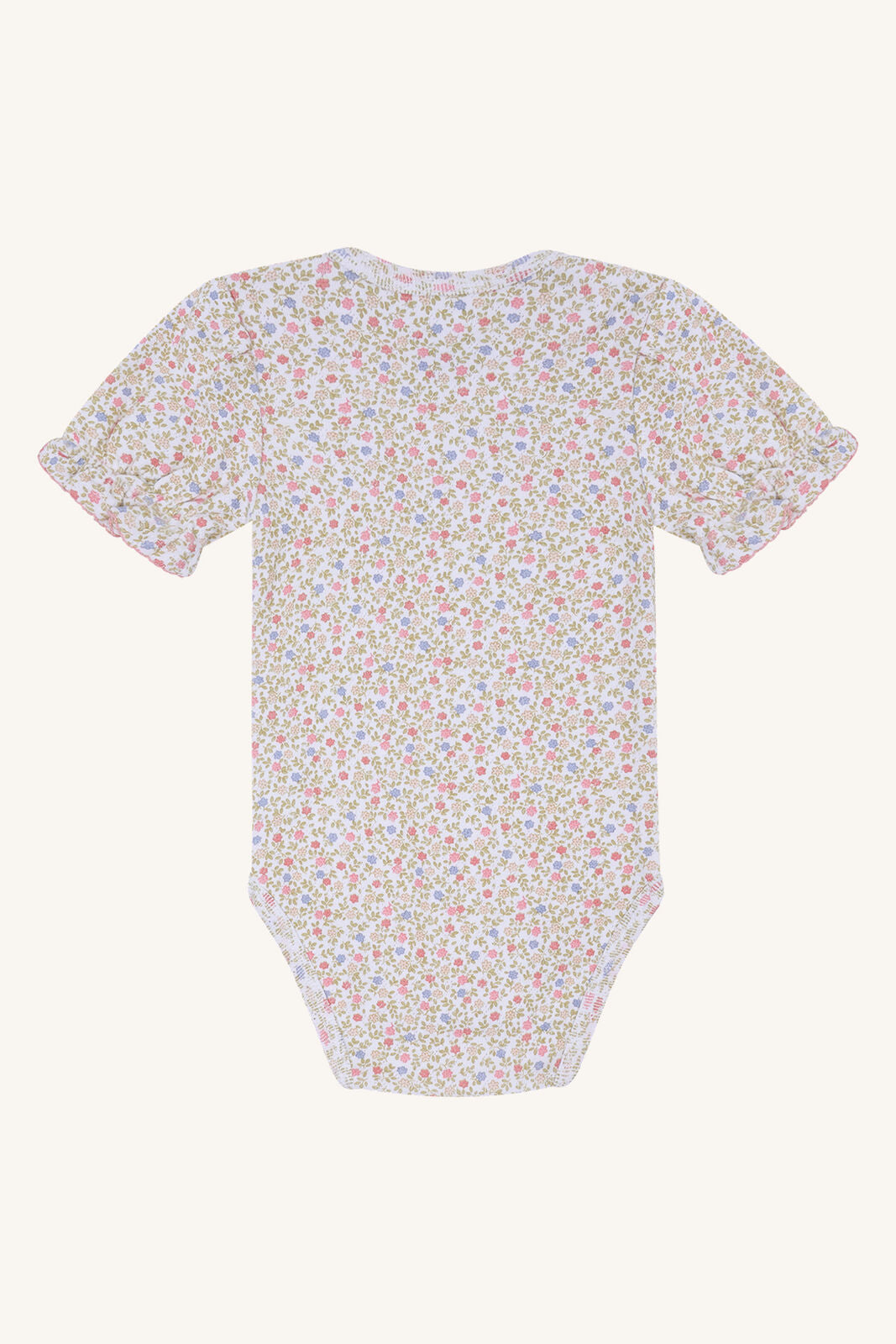 Unterer Bodybereich mit Druckknöpfen vom Hust&Claire Britt Blooming Body aus GOTS-zertifizierter Baumwolle, im Bärechind Winterthur, Zürich, Schweiz.