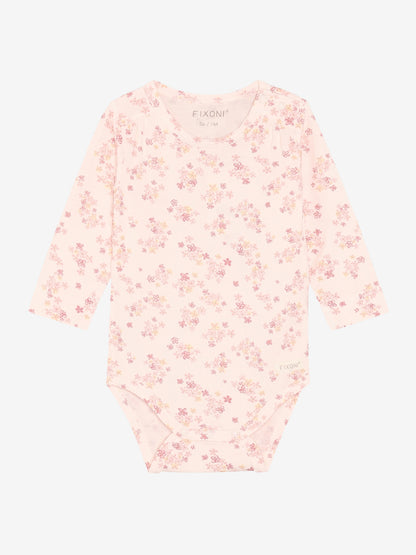 Rosa Langarmbody aus Baumwolle mit Blumenmuster von FIXONI, erhältlich im Bärechind Kinderladen Winterthur Zürich Schweiz