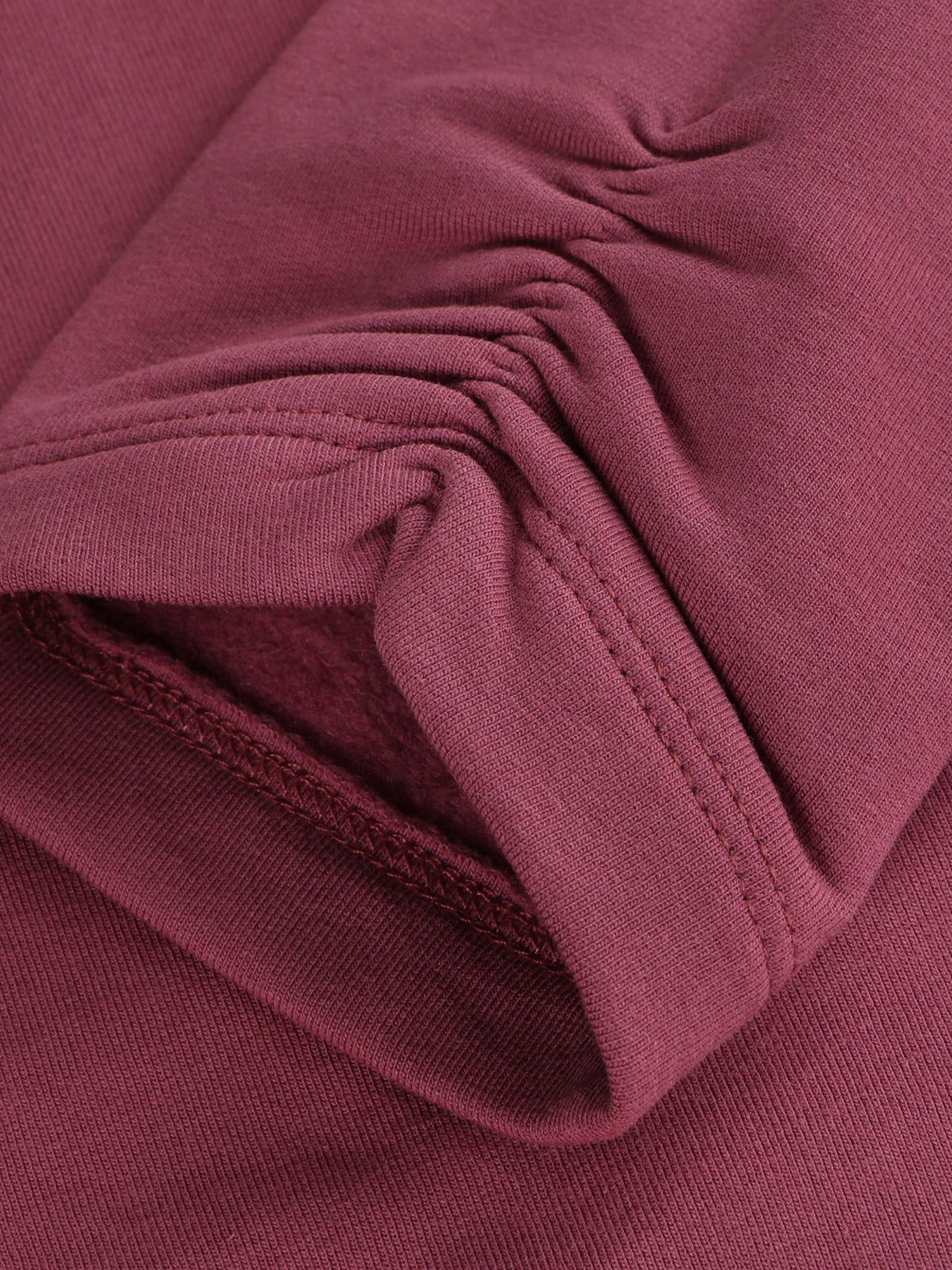 Minymo Bio Sweatleggings in Crushed Berry, Detailansicht Stoff